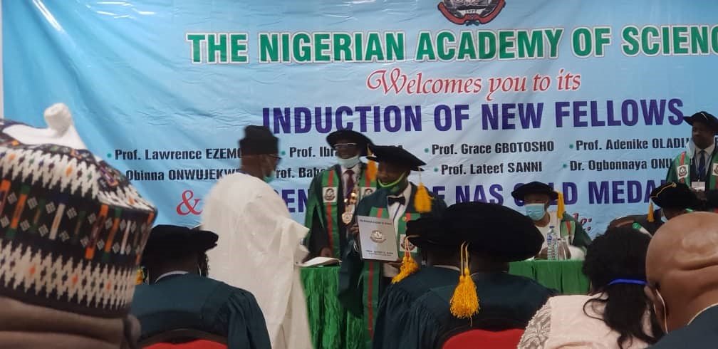 Prof. Lateef Sanni receiving his award of fellowship of the Nigerian Academy of Science